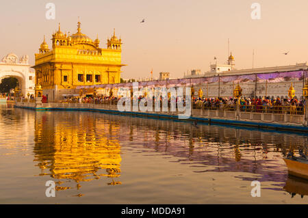 AMRITSAR, INDIA -22 SEPTEMBER, 2010: Sikh pilgrims in the Golden Temple Amritsar, Punjab, India. Stock Photo