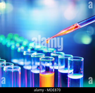 Pipette Dropping A Sample Into A Test Tube Stock Photo