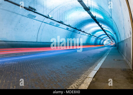 Long exposure of the inside of a artificially illuminated traffic tunnel Stock Photo