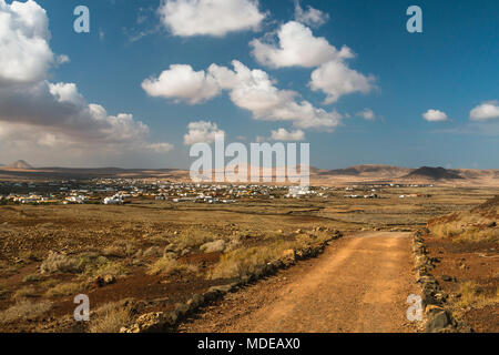 View to the village Lajares in Fuerteventura, Spain with a dirt road leading into the image. Stock Photo