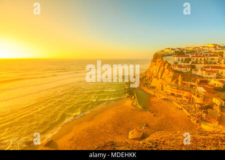 Scenic promontory at sunset light of Azenhas do Mar on Atlantic Ocean, a popular Portuguese seaside resort near Colares in municipality of Sintra. Destination of summer holidays in Portugal. Stock Photo