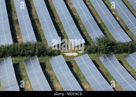 Looking down on some of the photovoltaic arrays that comprise the Milborne Port Solar Farm, near Milborne Port, Somerset. Stock Photo