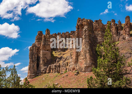 Majestic rock formations thrust from the ground at the John Day National Monument Clarno Unit. 18 miles west of Fossil Oregon. Volconic lahars formed  Stock Photo