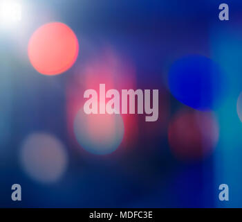Abstract blurred background. Multicolored light spots on a dark background. Stock Photo