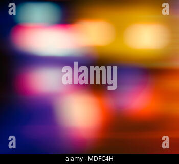 Abstract blurred background. Multicolored light spots on a dark background. Stock Photo