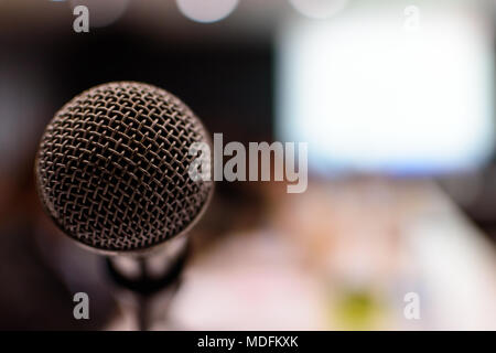 Close up of microphone in meeting room for conference blur background. Microphone in Conference Seminar room Event Background. Stock Photo