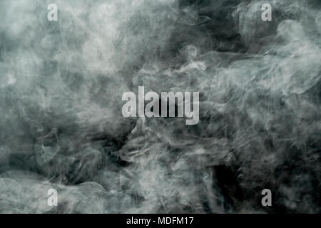 Abstract White smoke isolated on black background. Abstract smog clouds. Stock Photo