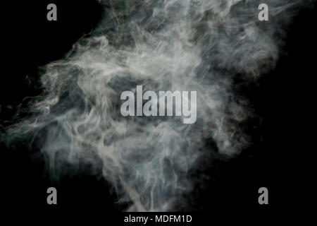 Abstract White smoke isolated on black background. Abstract smog clouds. Stock Photo