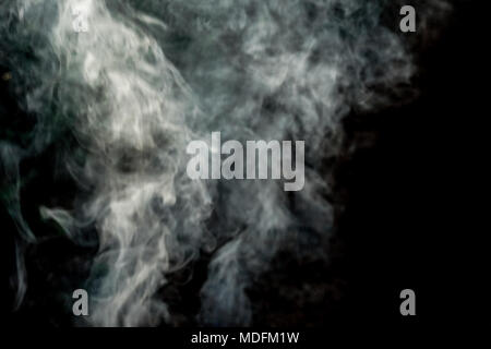 Abstract White smoke isolated on black background. Abstract smog clouds. Stock Photo