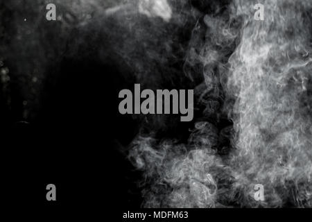 Abstract White smoke isolated on black background. Abstract smog clouds. Stock Photo