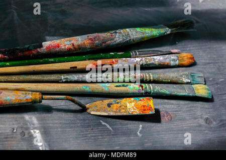 pallet knife and brushes on an artist's pallet Stock Photo