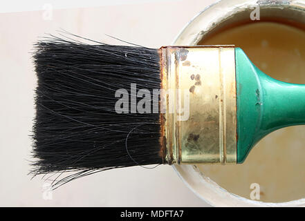 Overhead view of a paintbrush on a paint tin Stock Photo