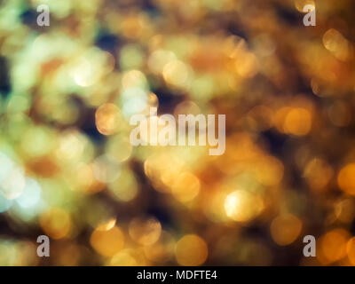 Abstract golden bokeh light on black background Stock Photo