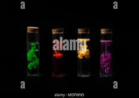 Test tubes filled with water and multi coloured acrylic paint Stock Photo