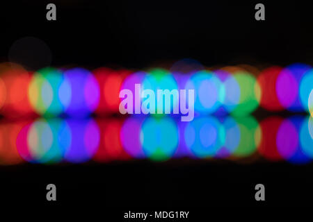 Bokeh colorful circles  background  of primary colors in two horizontal rows Stock Photo