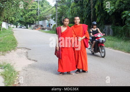 Two young monks on Watnak Nyai Road. Vientiane, Laos, 2015. Stock Photo