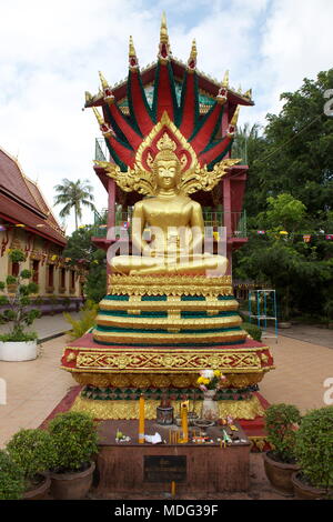 Buddha statue shelter under nagas. Wat Chanthaboury Buddhist temple. Vientiane, Laos, 2015. Stock Photo