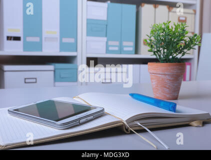Workplace business still life. blank empty notebook, laptop, tablet pc, mobile phone, pen Stock Photo