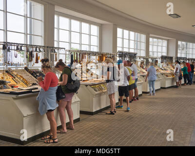 Jewelry and souvenirs for sale in the covered arcade by the pier in the summer holiday resort town of Sopot Poland near Gdansk on the Baltic coast Stock Photo