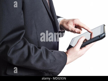 Side view of a business man in a suit, holding a tablet computer and touching the screen with his finger. Isolated on white. Face not visible. Stock Photo
