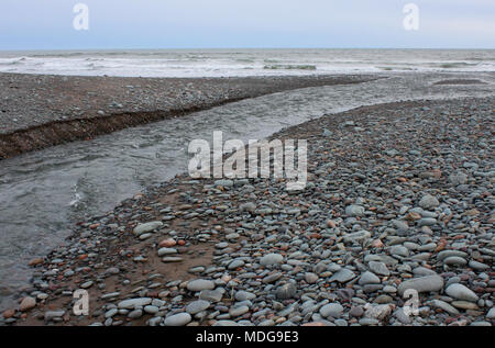 Temporary stream draining Big Lake after barrier breach at Long Beach, Lower East Chezzetcook, Nova Scotia, Canada Stock Photo