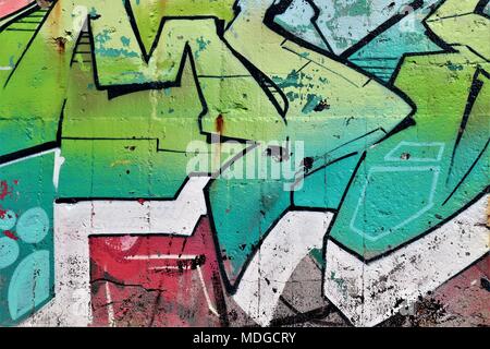Graffitti on a World War Two Bunker on the Atlantic Beaches of the Gironde in Shades of Green Stock Photo