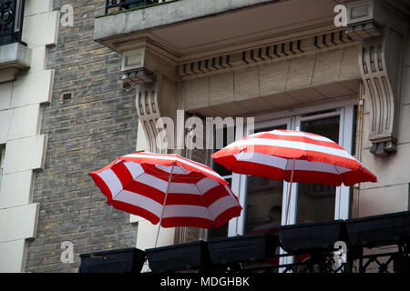 Two umbrellas on a balcony in Paris France Stock Photo