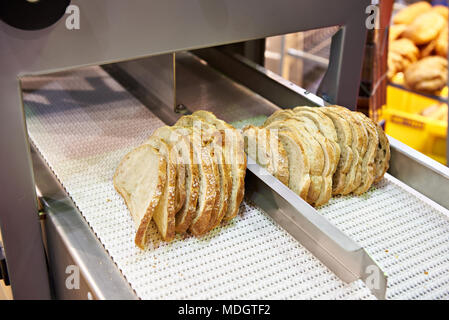 Bread slicer machine in food and bekery production line Stock