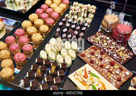 Cakes, candies and sweets in the shop window Stock Photo
