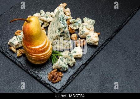 Slice of French Roquefort cheese and pear Stock Photo