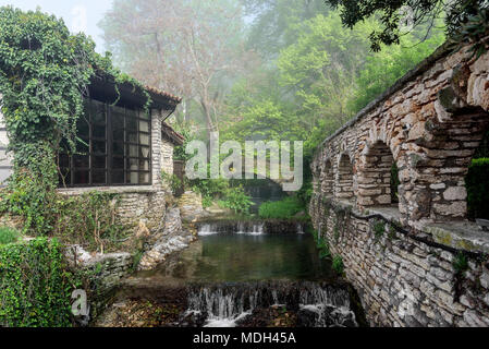 An old stone building and a gazebo in the forest. Stock Photo