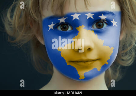 Child with a painted flag of Kosovo Stock Photo