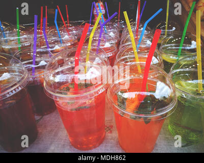 lemonade with mint and lemons space in plastic glass with straws street food Stock Photo