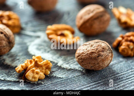 Walnuts and kernels on wooden backgound Stock Photo