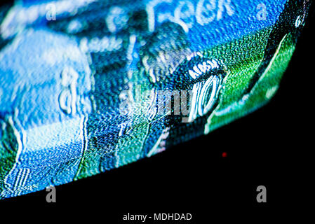 TV screen with weak signal during broadcasting of a football match. Red indicator turned on in the darkness. Television reception problems. Stock Photo