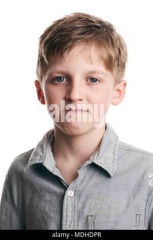 Portrait of a young boy with a determined look on his face on a white background Stock Photo