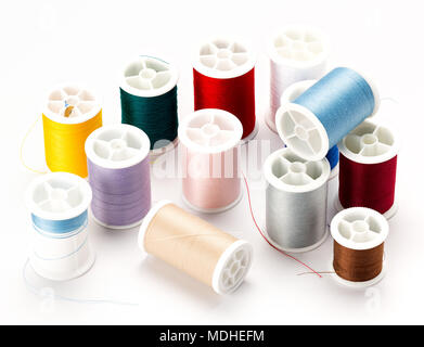 Sewing thread on spools with many colors Stock Photo