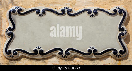 Blank empty ceramic street sign on a plastered wall, space for text, banner. Mdina, Malta Stock Photo