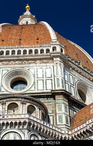 Close-up of Brunelleschi's Dome of Florence Cathedral decorative details of facade and blue sky; Florence, Tuscany, Italy Stock Photo