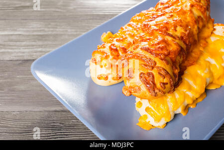 cheesy italian buns close-up on wooden background Stock Photo
