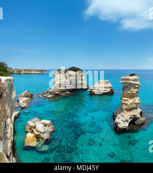 Picturesque seascape with cliffs and stacks (faraglioni), at Torre Sant Andrea, Salento sea coast, Puglia, Italy. Two shots stitch image. Stock Photo