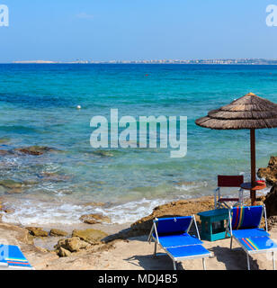 Picturesque Ionian sea beach Punta della Suina, Salento, Puglia, Italy. Gallipoli town view in far. Two shots stitch image. Stock Photo