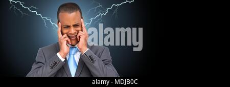 Lightning strikes and stressed man with headache holding head Stock Photo