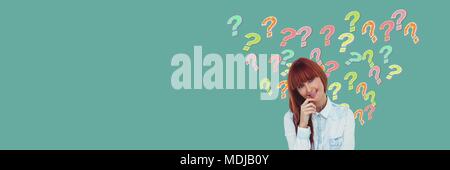 Woman thinking with colorful funky question marks Stock Photo