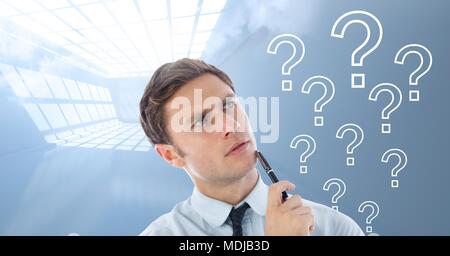 Man thinking with question marks Stock Photo