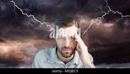 Lightning strikes and stressed man with headache holding head Stock Photo