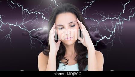 Lightning strikes and stressed woman with headache holding head Stock Photo