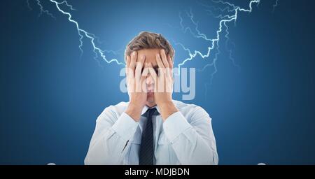 Lightning strikes and stressed man with headache holding head Stock Photo