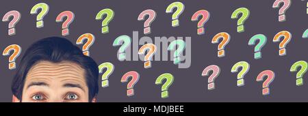 Man thinking with colorful funky question marks Stock Photo