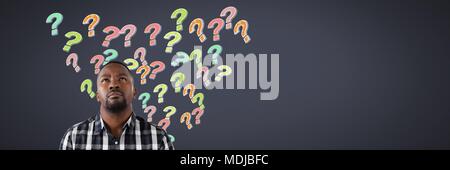 Man with colorful funky question marks emerging from head Stock Photo